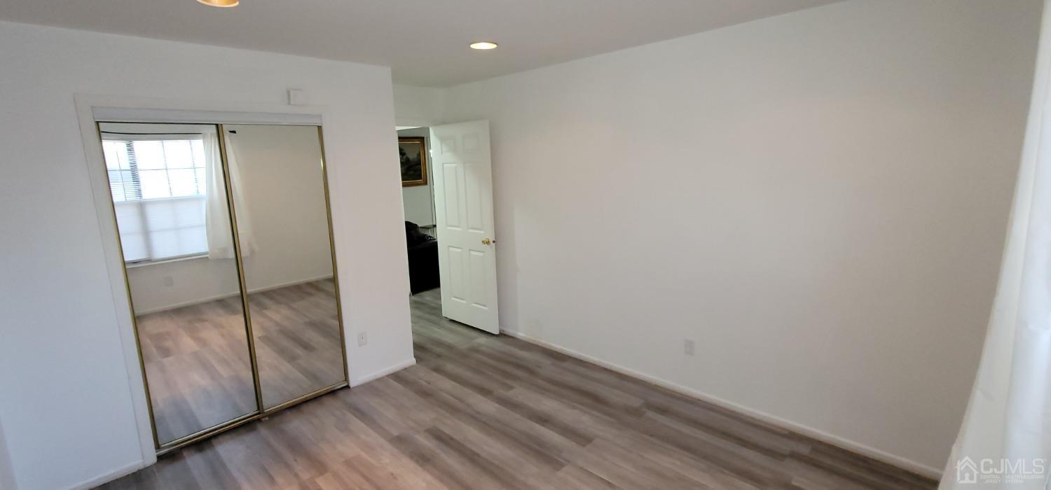 40 Boulder Drive Edison, NJ 08817 - Photo 16 of 23 a view of hallway with wooden floor