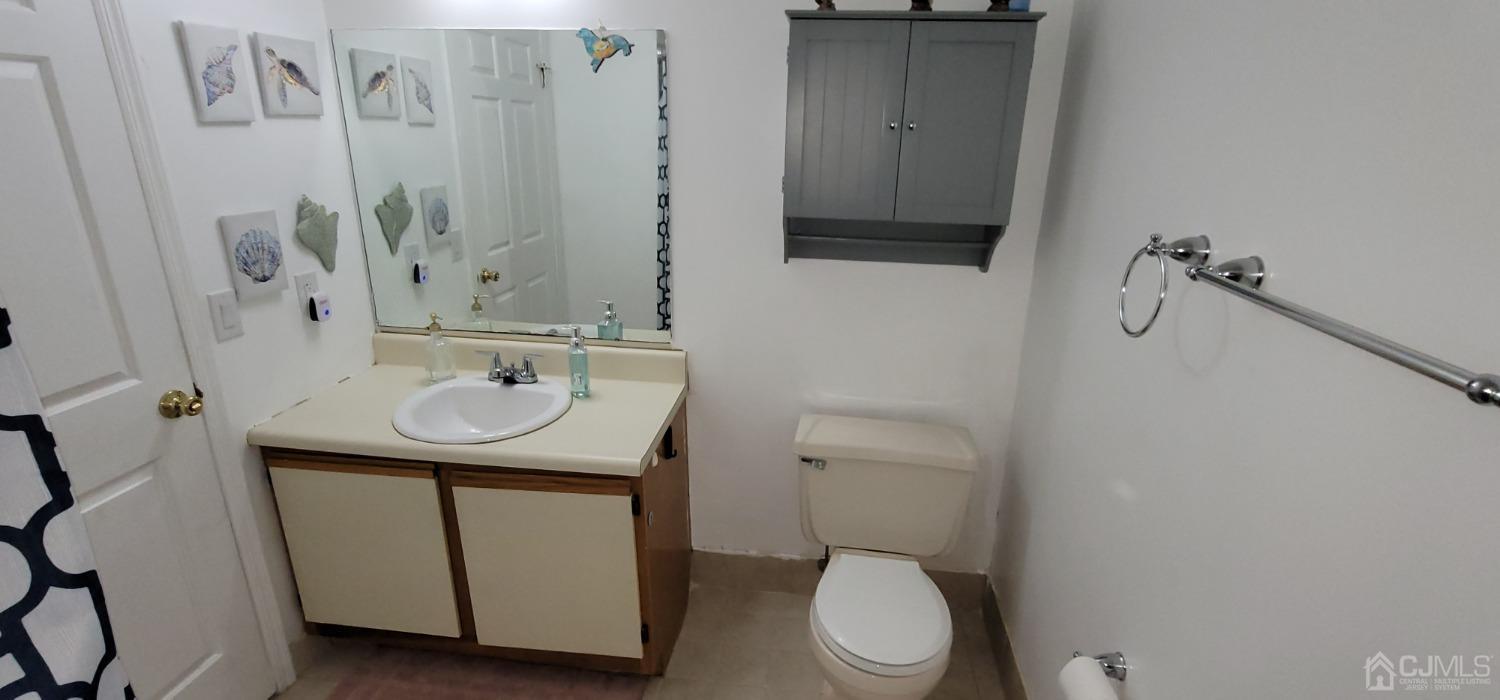 40 Boulder Drive Edison, NJ 08817 - Photo 19 of 23 a bathroom with a sink a toilet and shower