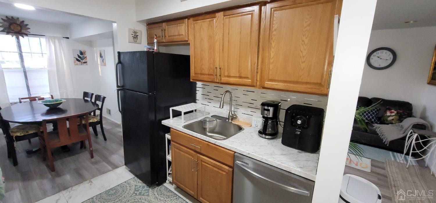40 Boulder Drive Edison, NJ 08817 - Photo 5 of 23 a kitchen with stainless steel appliances granite countertop a refrigerator a sink a stove and a refrigerator