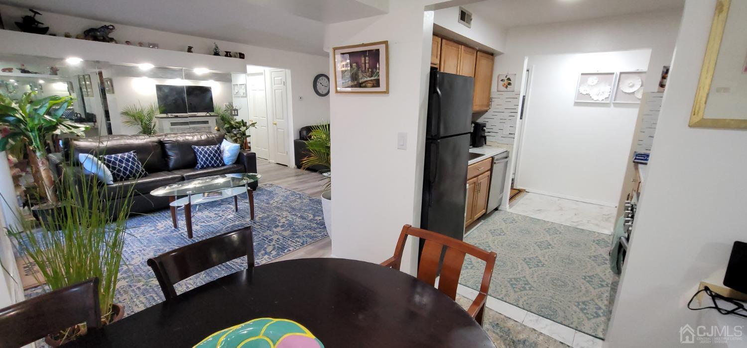 40 Boulder Drive Edison, NJ 08817 - Photo 8 of 23 a living room with furniture and a flat screen tv