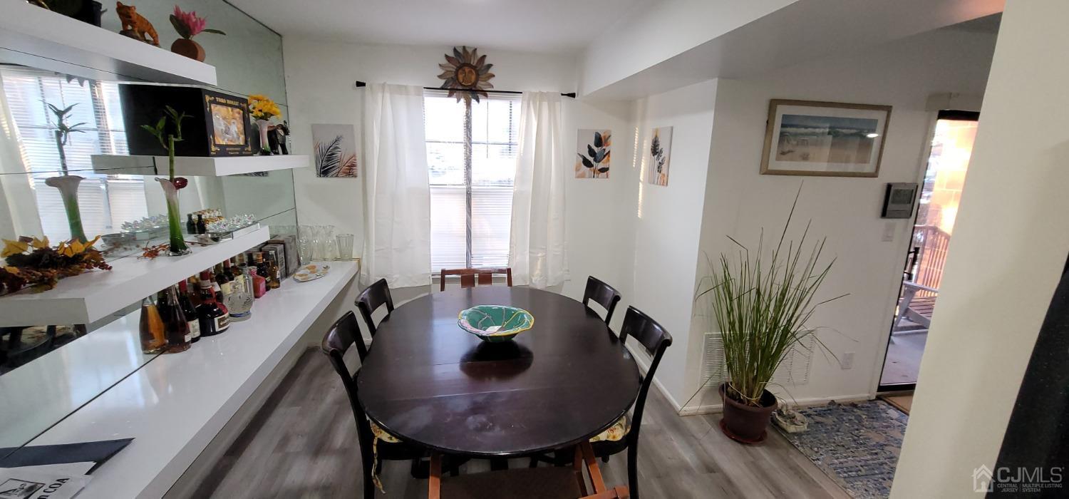 40 Boulder Drive Edison, NJ 08817 - Photo 9 of 23 a view of a dining room with furniture window and wooden floor