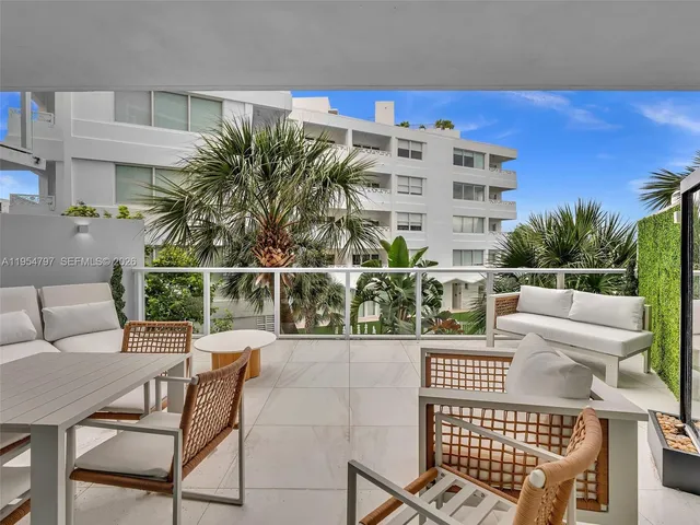 a outdoor space with a couch and chairs