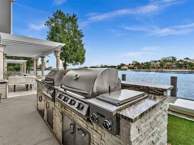 a view of a swimming pool with outdoor seating