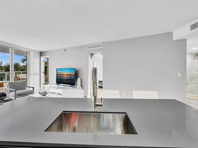 a view of a living room and a flat screen tv