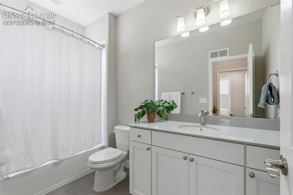 1394 Promontory Bluff View Colorado Springs, CO 80921 - Photo 21 of 47 a bathroom with a sink a toilet and shower