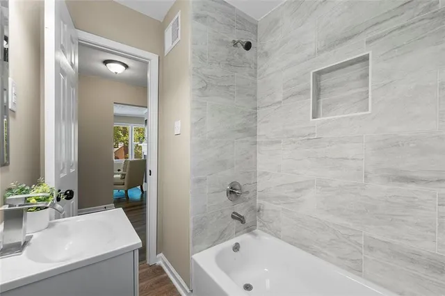 a bathroom with a sink and a bathtub