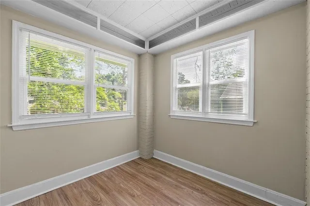 a view of a yard with large trees