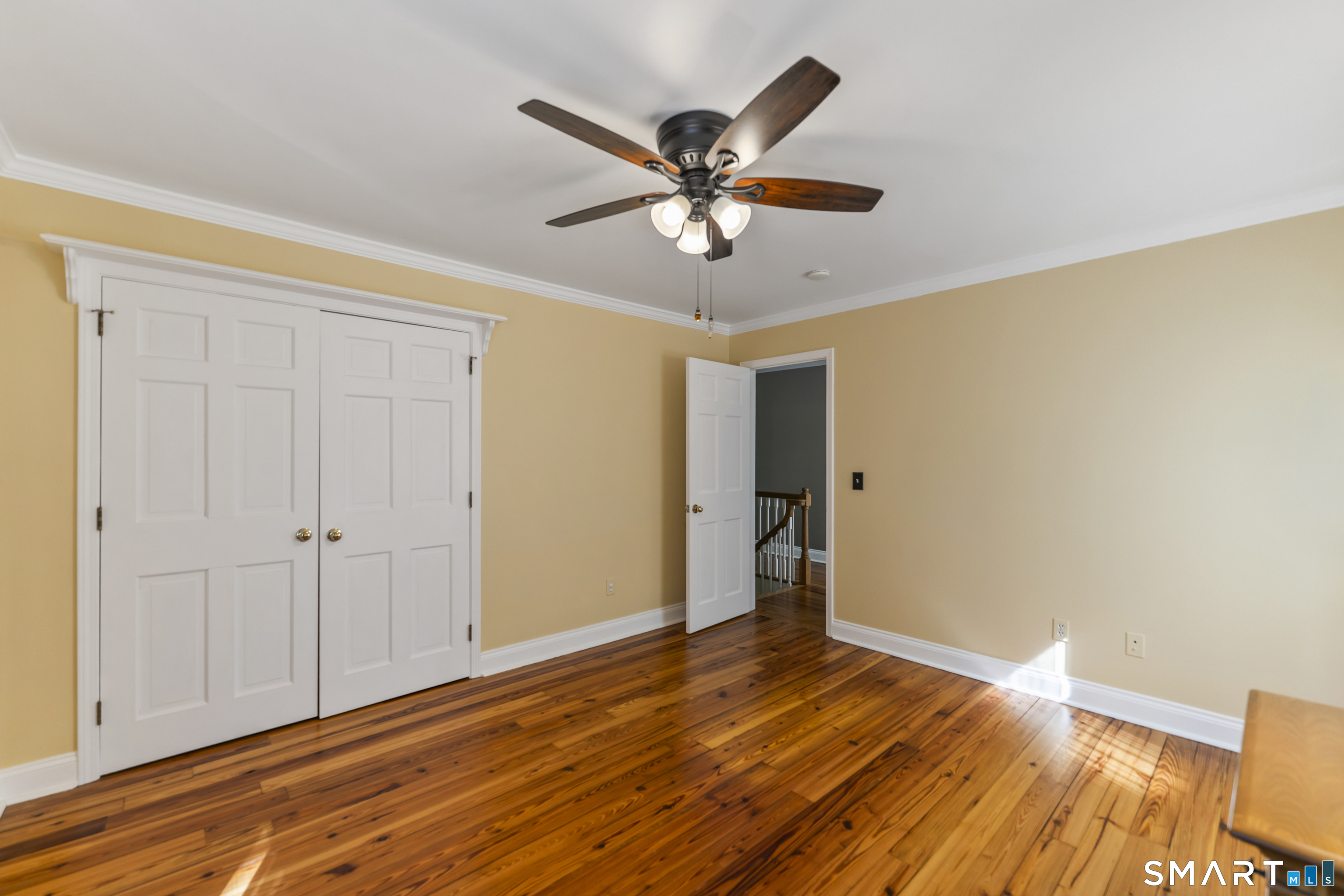 18 Gelding Hill Road Newtown, CT 06482 - Photo 23 of 40 a view of a livingroom with wooden floor and a ceiling fan