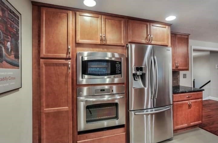 749 Worcester Street Wellesley, MA 02481 - Photo 3 of 17 a metallic refrigerator freezer sitting in a kitchen