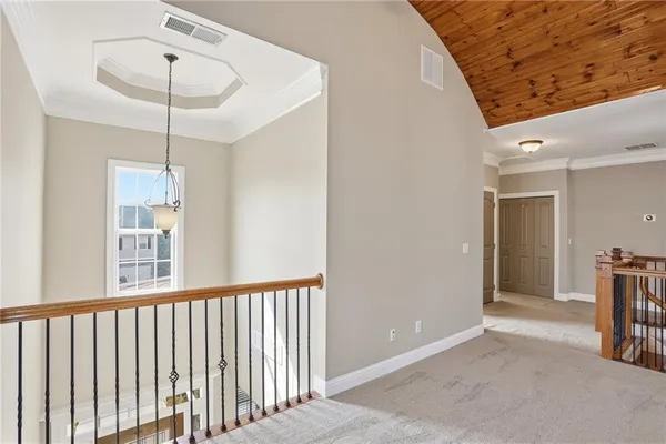 a view of a hallway with windows