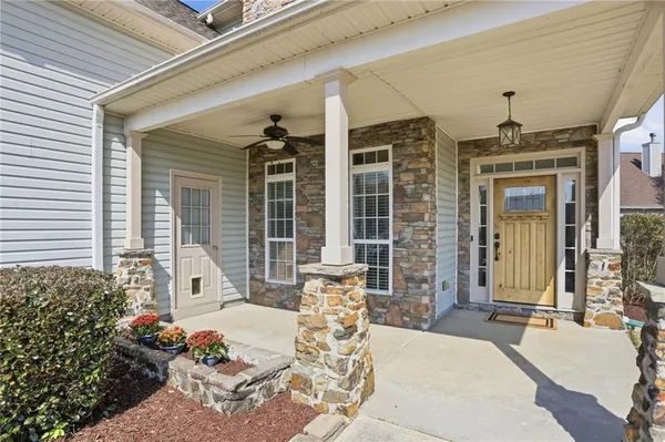a front view of a house with outdoor seating