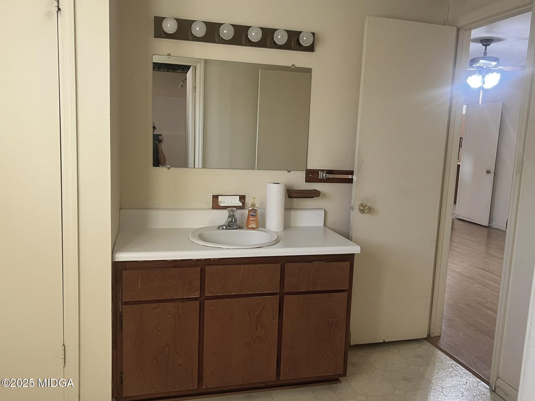 3640 South Walden Road Macon, GA 31216 - Photo 13 of 21 a bathroom with a sink and a mirror