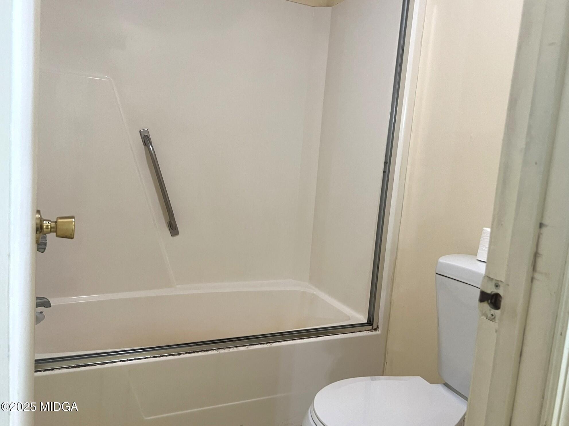 3640 South Walden Road Macon, GA 31216 - Photo 14 of 21 a bathroom with a toilet and a shower