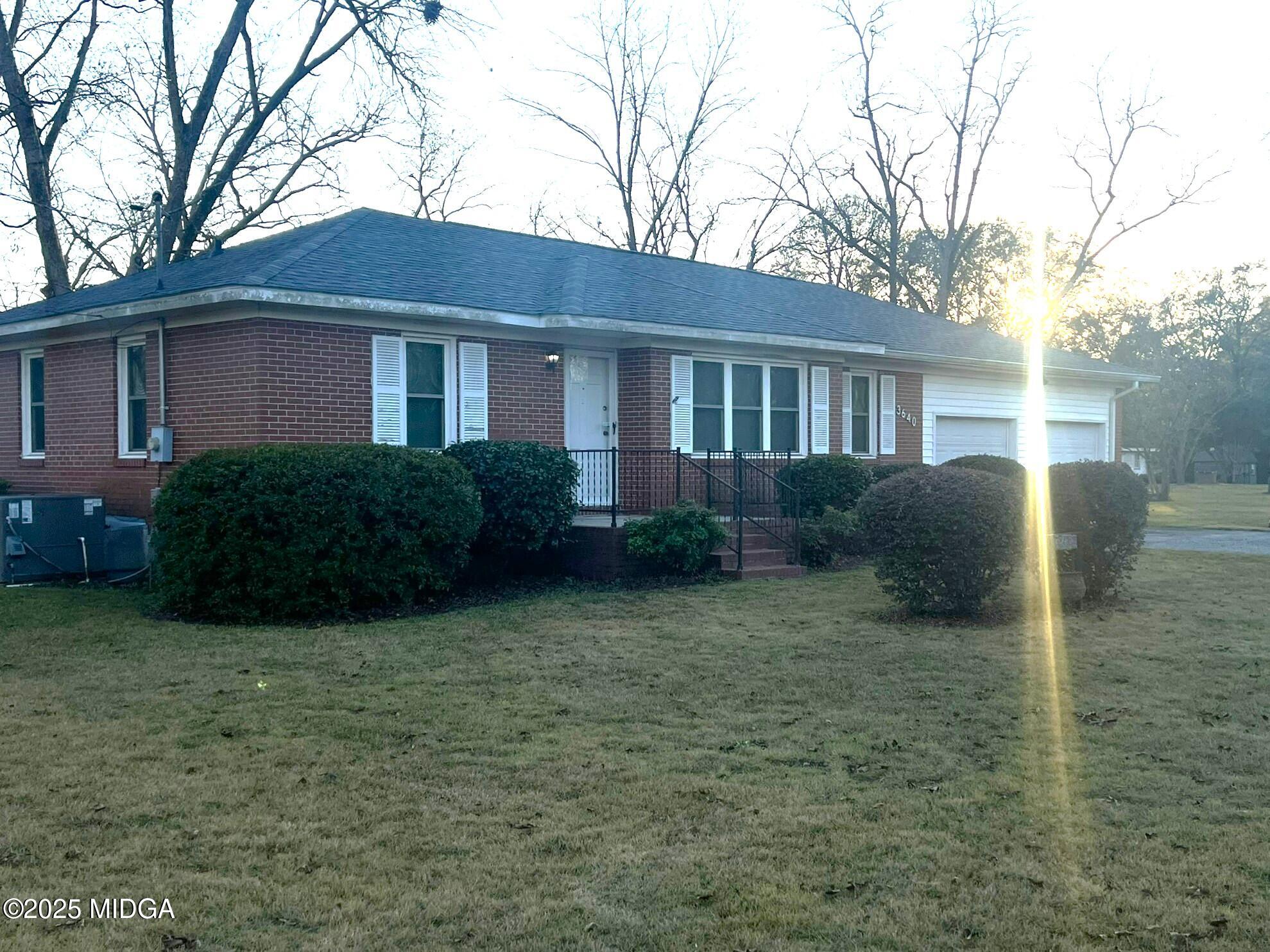 3640 South Walden Road Macon, GA 31216 - Photo 2 of 21 a house that has a tree in front of it