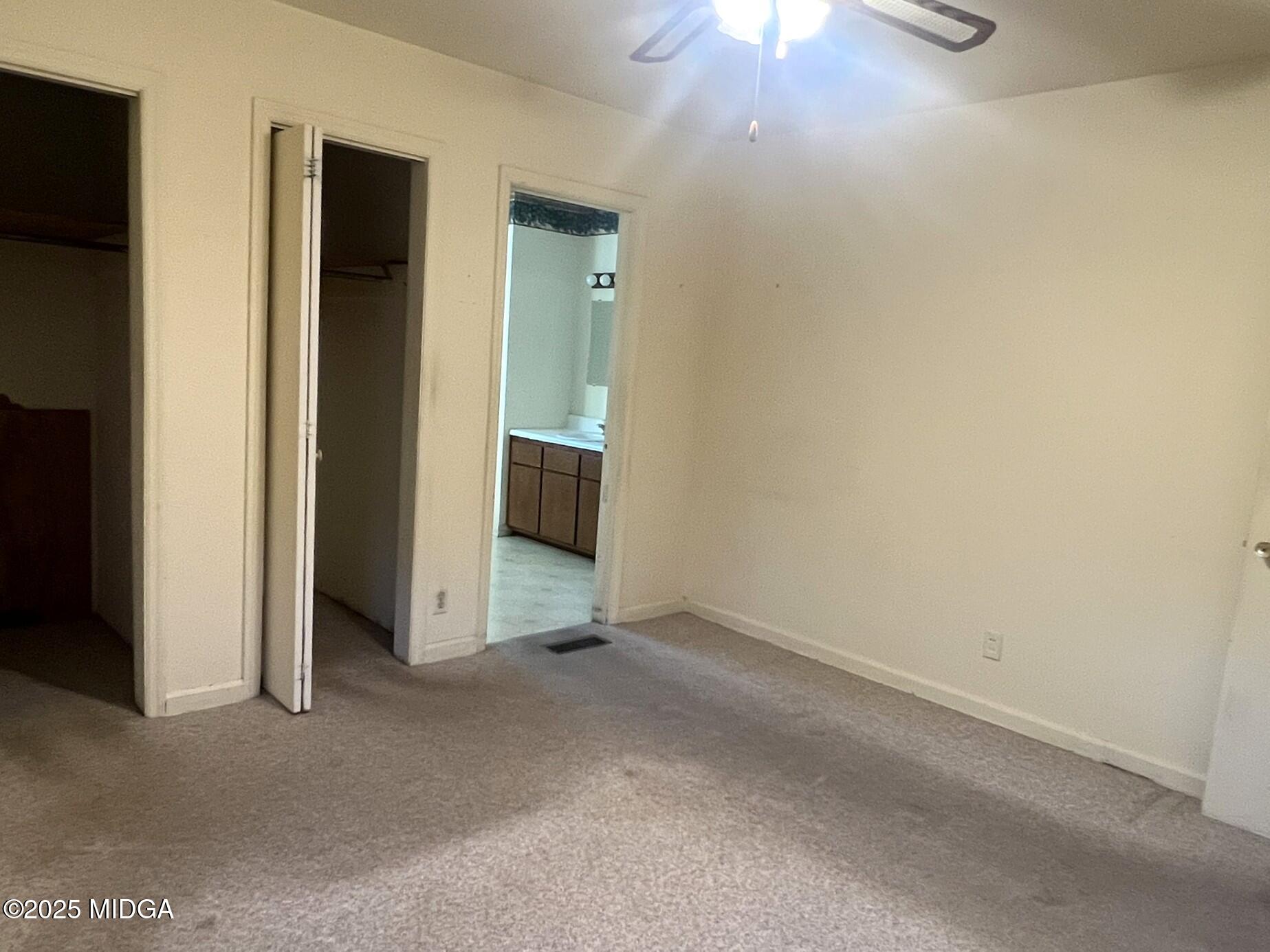 3640 South Walden Road Macon, GA 31216 - Photo 10 of 21 an empty room with closet and windows