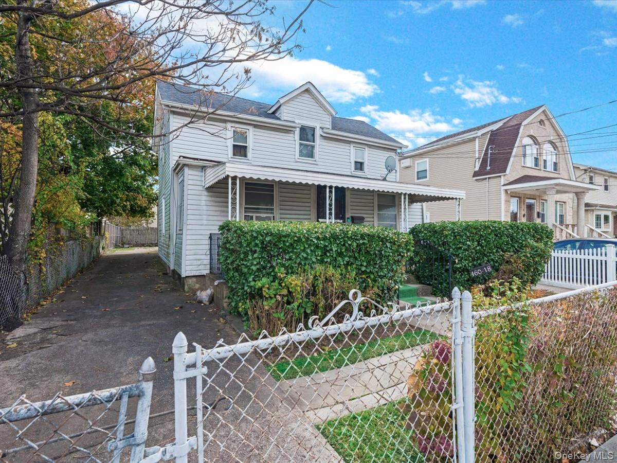 160-18 128th Avenue Queens, NY 11434 - Photo 3 of 5 a front view of a house with garden
