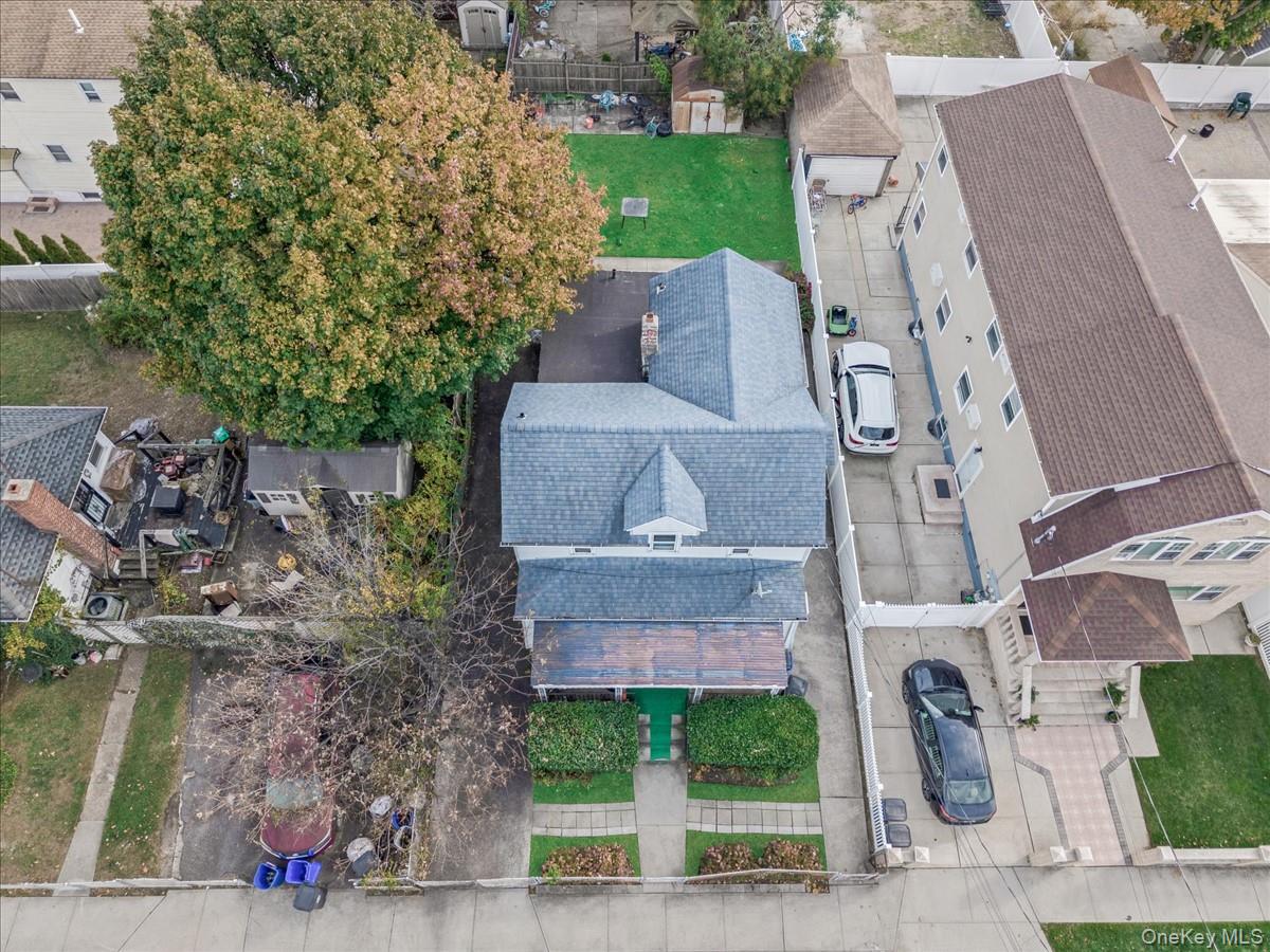 160-18 128th Avenue Queens, NY 11434 - Photo 5 of 5 an aerial view of a house with garden space and street view