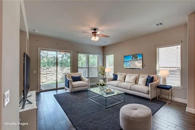 a living room with furniture and a large window