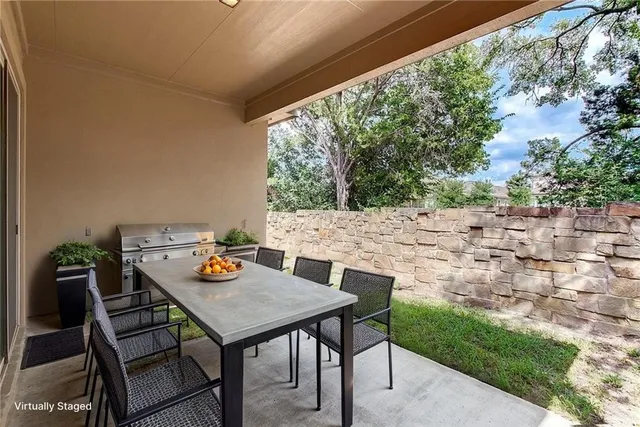 a view of a yard with a tree