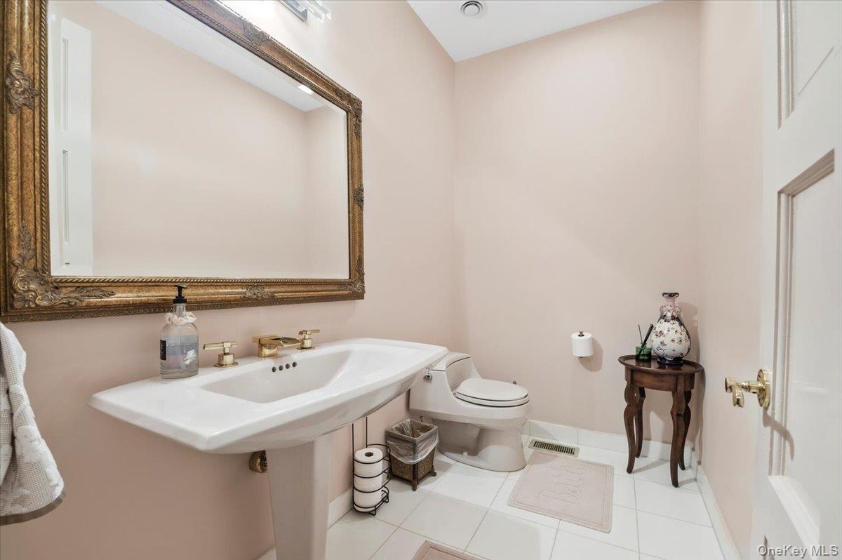 12 Ridge Court Glen Head, NY 11545 - Photo 25 of 46 Half bath featuring tile patterned flooring
