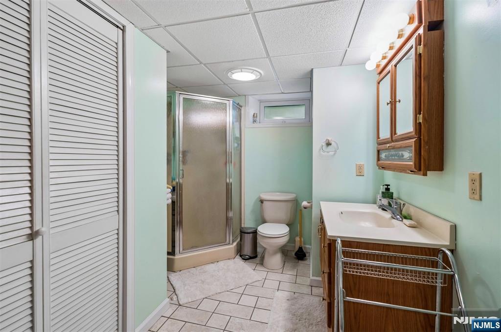 6 Waters Edge Butler, NJ 07405 - Photo 17 of 28 a bathroom with a sink toilet and shower