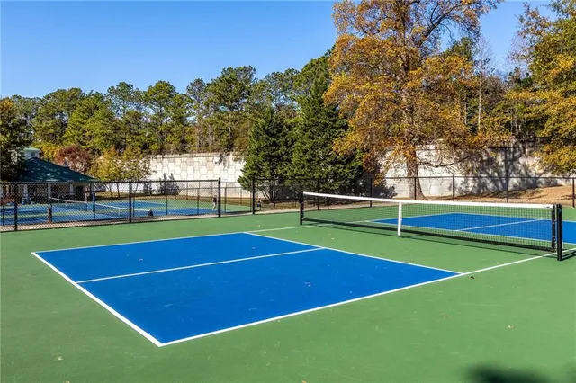a view of an outdoor space and tennis court