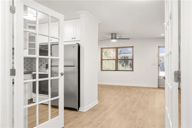 a view of an empty room with a window