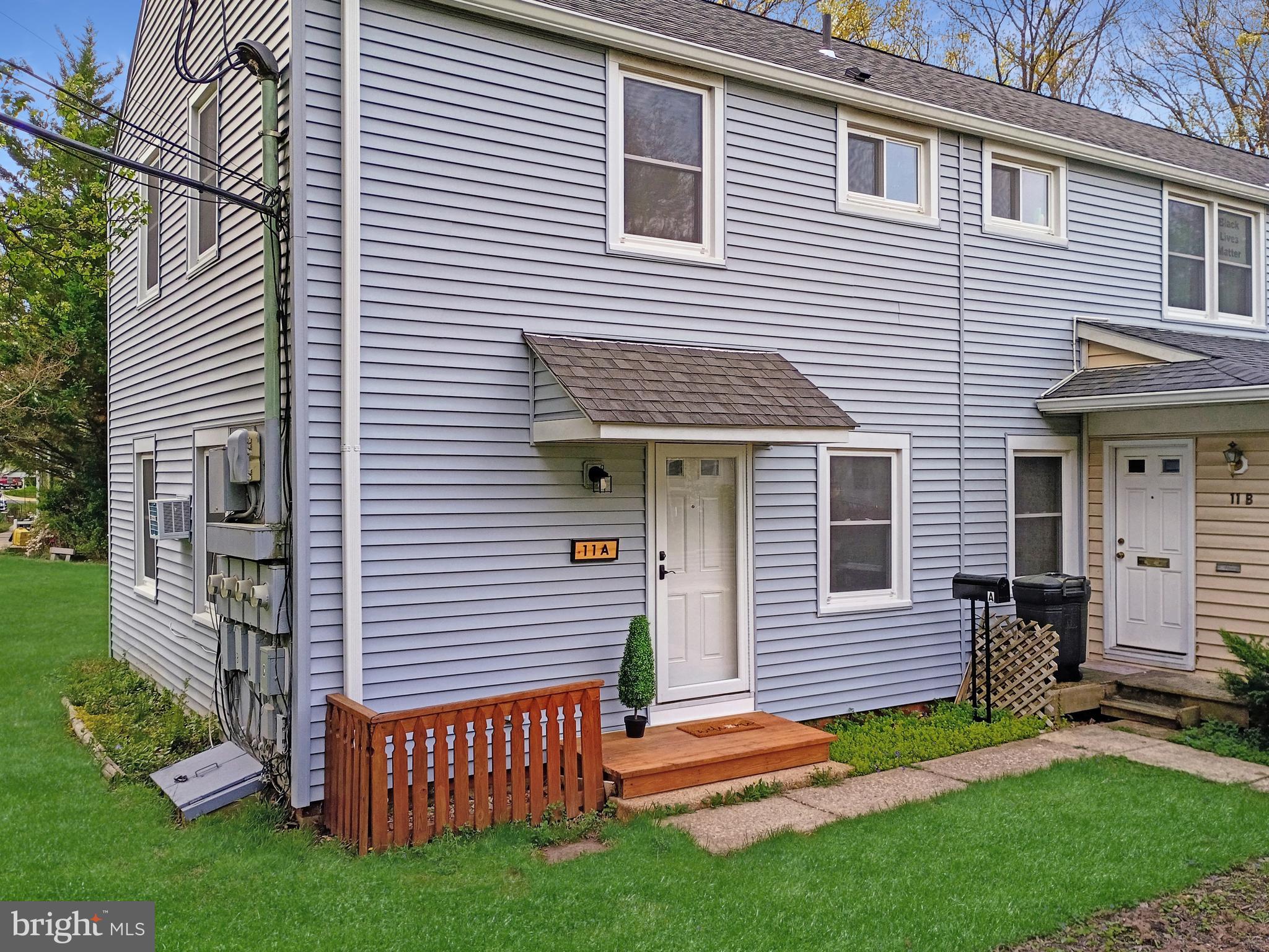 11 Hillside Road Greenbelt, MD 20770 - Photo 2 of 47 a view of a house with a yard and a large window