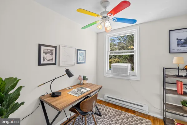 a workspace with furniture and window