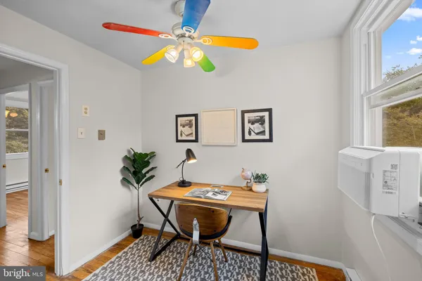 a workspace with furniture and rug