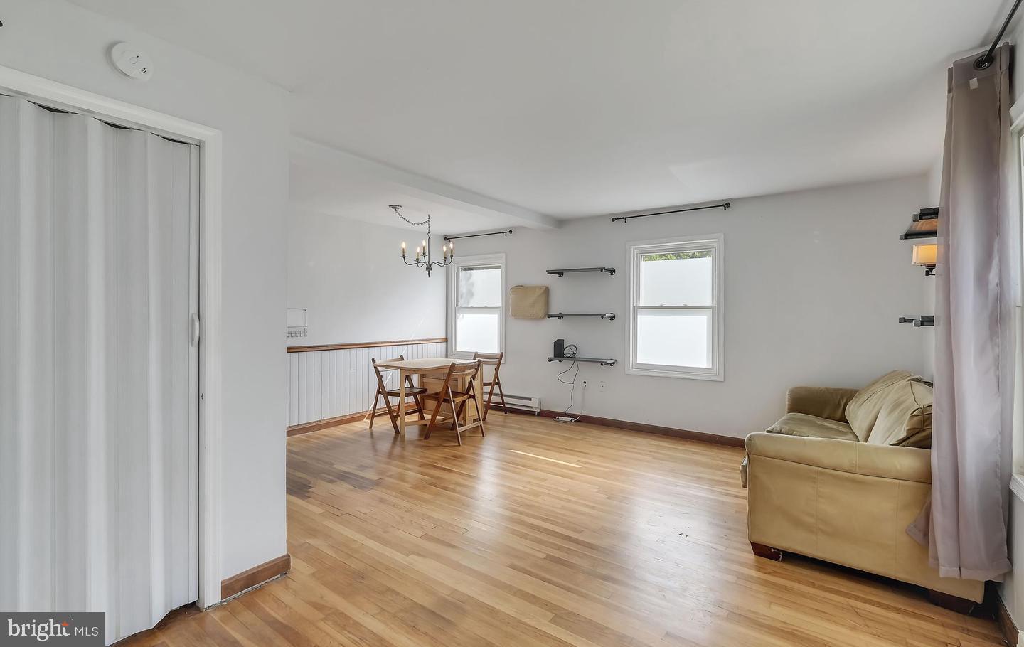 11 Hillside Road Greenbelt, MD 20770 - Photo 30 of 47 a living room with furniture and a table