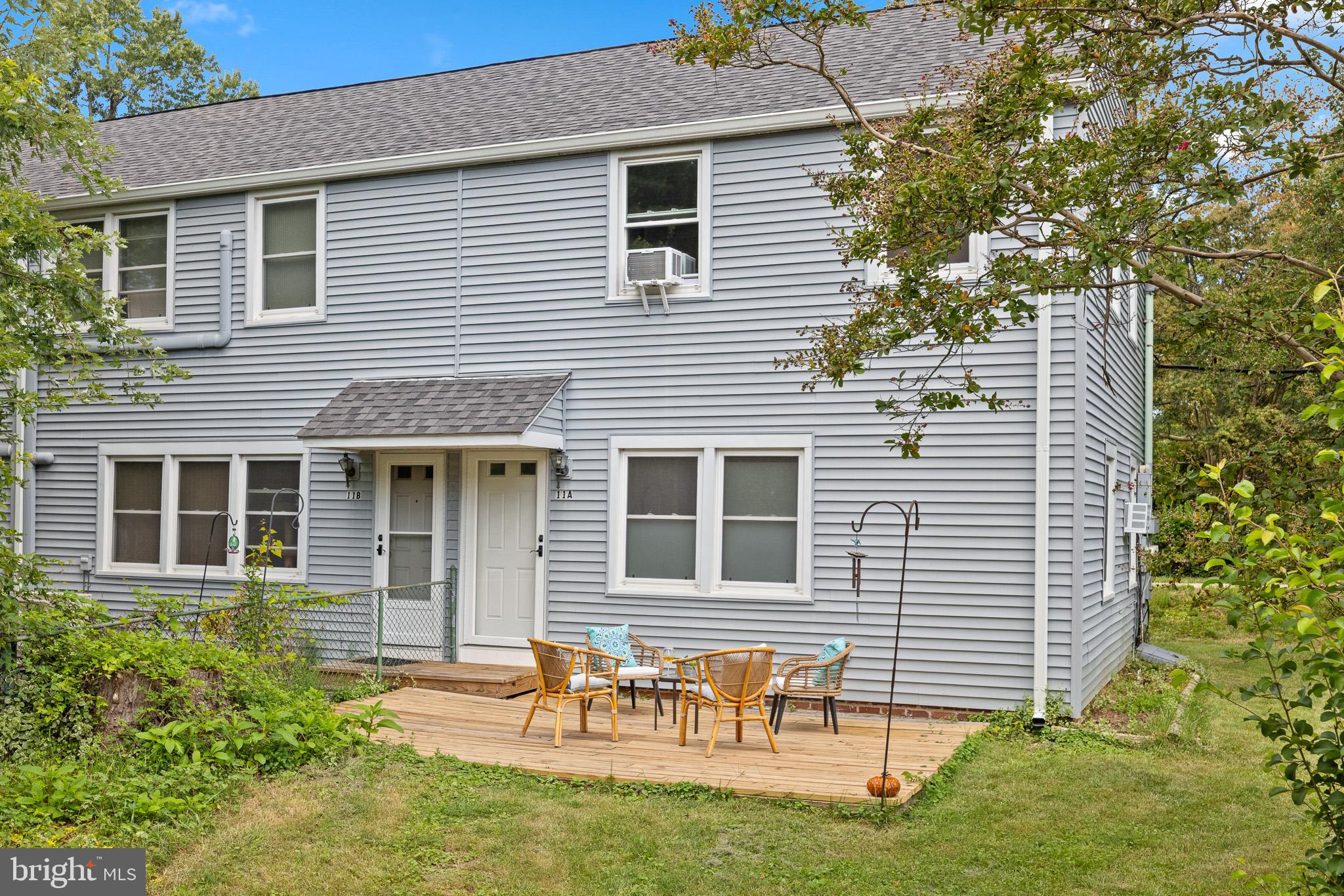 11 Hillside Road Greenbelt, MD 20770 - Photo 31 of 47 a backyard of a house with table and chairs