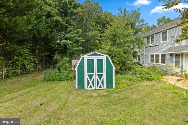 a house with trees in the background
