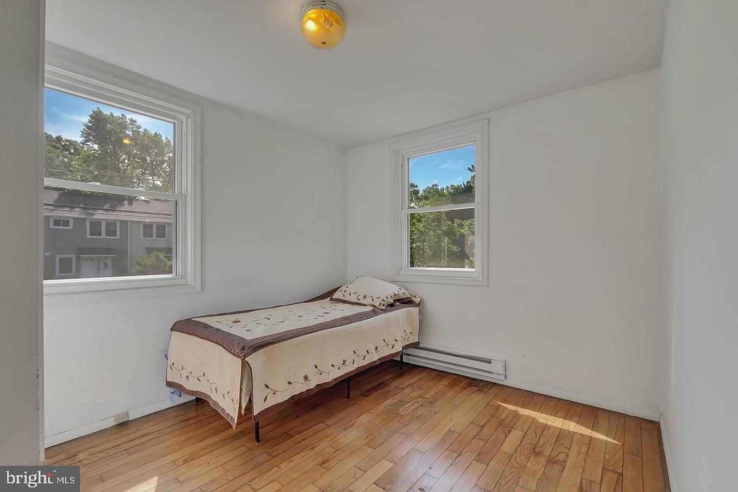 11 Hillside Road Greenbelt, MD 20770 - Photo 36 of 47 a bedroom with a bed and window