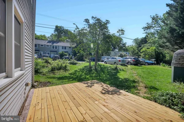 a view of backyard with plants and outdoor seating