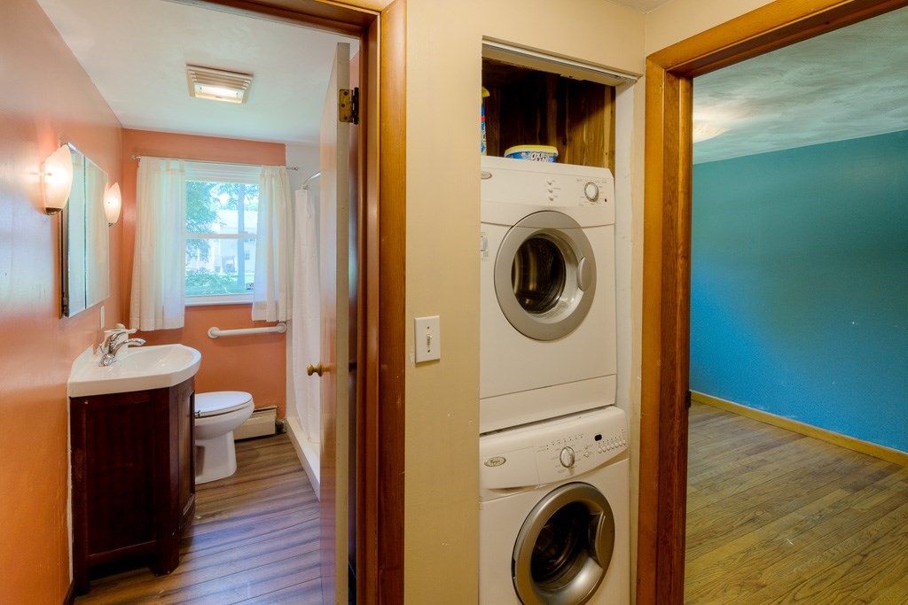 24 Edgewood Street Three Rivers, MA 01080 - Photo 24 of 37 a view of a hallway with washer and dryer