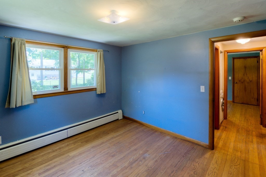 24 Edgewood Street Three Rivers, MA 01080 - Photo 25 of 37 an empty room with wooden floor and windows