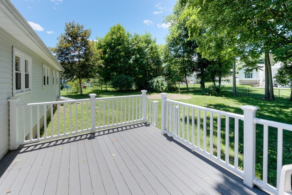 24 Edgewood Street Three Rivers, MA 01080 - Photo 3 of 37 a view of deck with wooden floor and fence