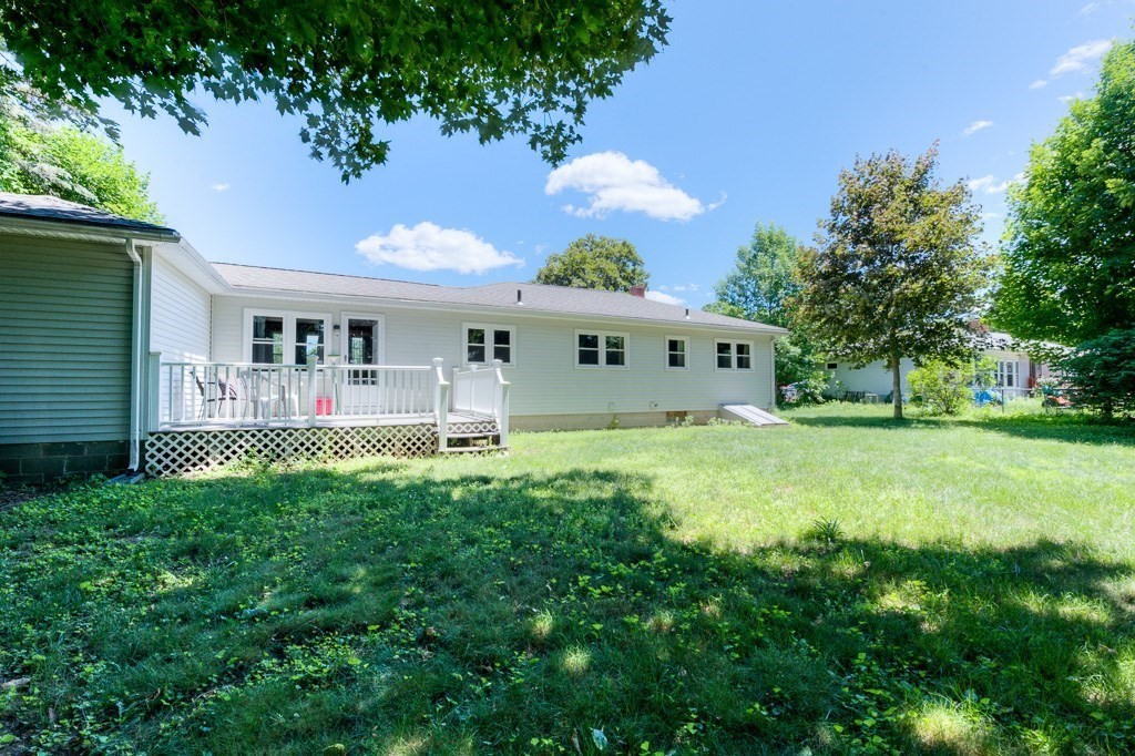 24 Edgewood Street Three Rivers, MA 01080 - Photo 35 of 37 a view of a house with a backyard porch and sitting area