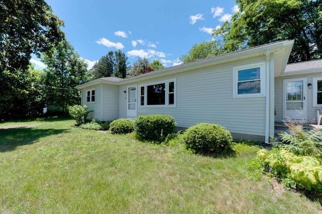 24 Edgewood Street Three Rivers, MA 01080 - Photo 36 of 37 a view of a house with a yard and plants