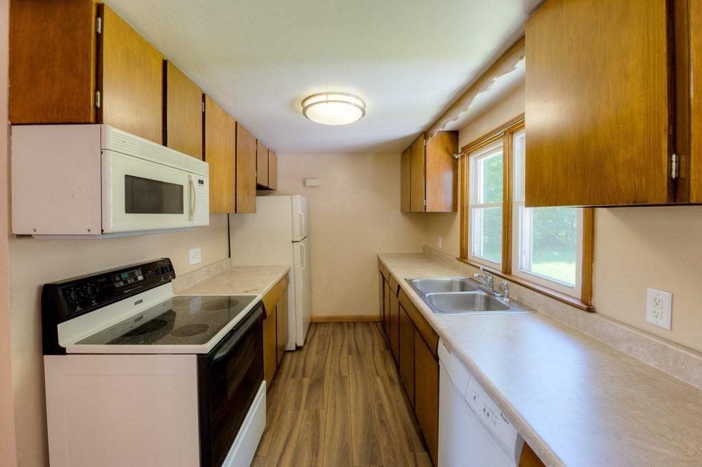 24 Edgewood Street Three Rivers, MA 01080 - Photo 5 of 37 a kitchen that has a sink and a stove in it