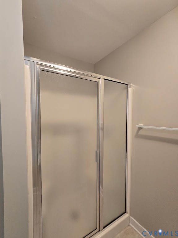 16406 Benmore Road Moseley, VA 23120 - Photo 17 of 32 a bathroom with a glass shower door