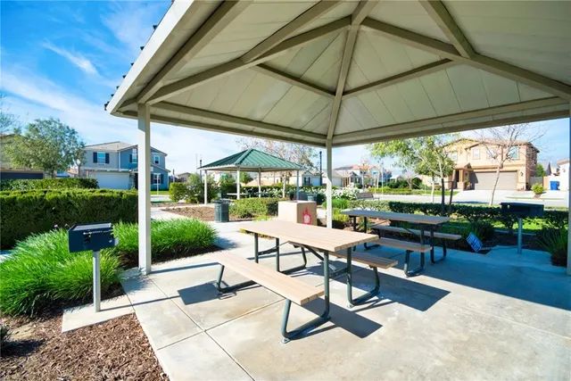 a view of a two chairs and table in the patio