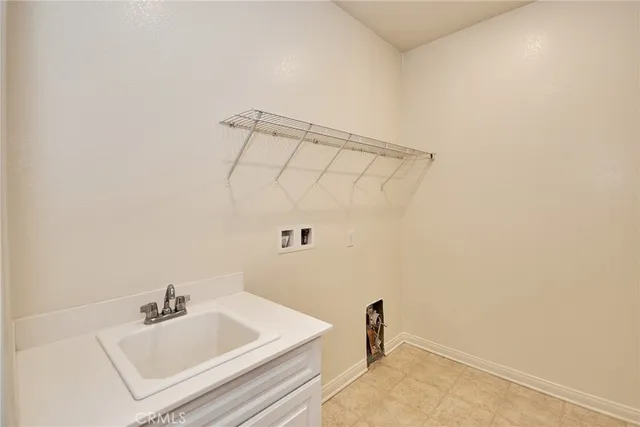 a bathroom with a sink and vanity