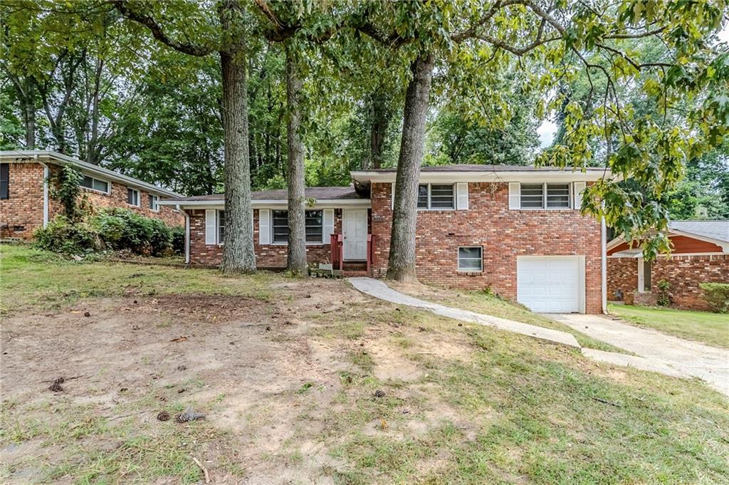 2324 Springdale Circle Southwest Atlanta, GA 30315 - Photo 1 of 1 front view of a house with a yard