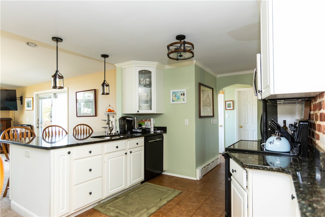 19 Silver Birch Road Warwick, RI 02888 - Photo 9 of 37 Kitchen Island with sink and storage open to Great Room.