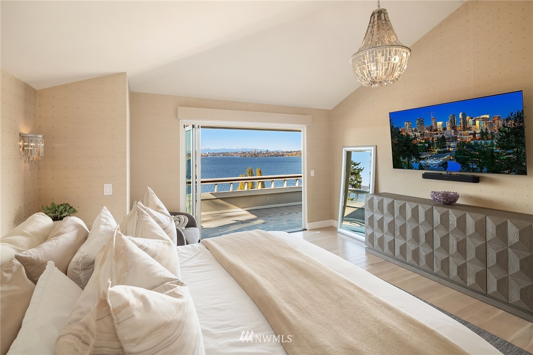 3223 Evergreen Point Road Medina, WA 98039 - Photo 14 of 36 a bedroom with a bed and chandelier