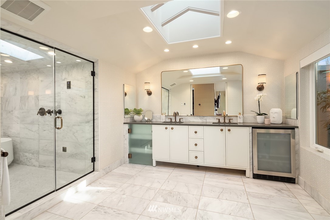 3223 Evergreen Point Road Medina, WA 98039 - Photo 15 of 36 a bathroom with a granite countertop sink mirror and shower