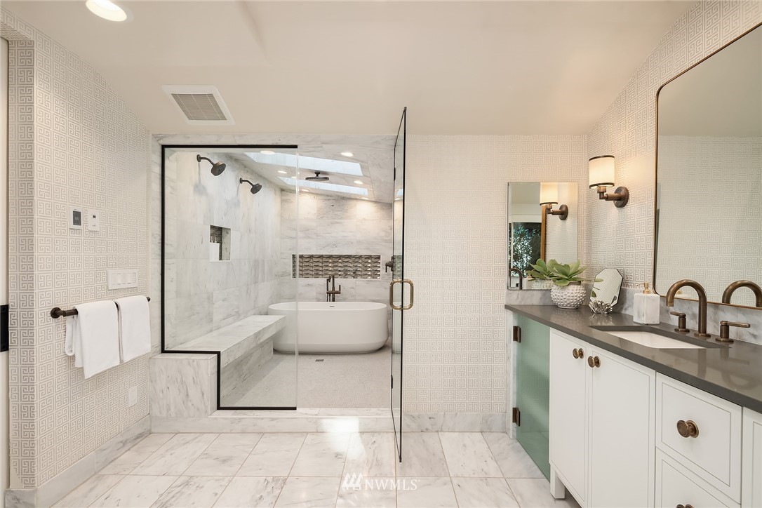 3223 Evergreen Point Road Medina, WA 98039 - Photo 16 of 36 a bathroom with a granite countertop sink a toilet and shower