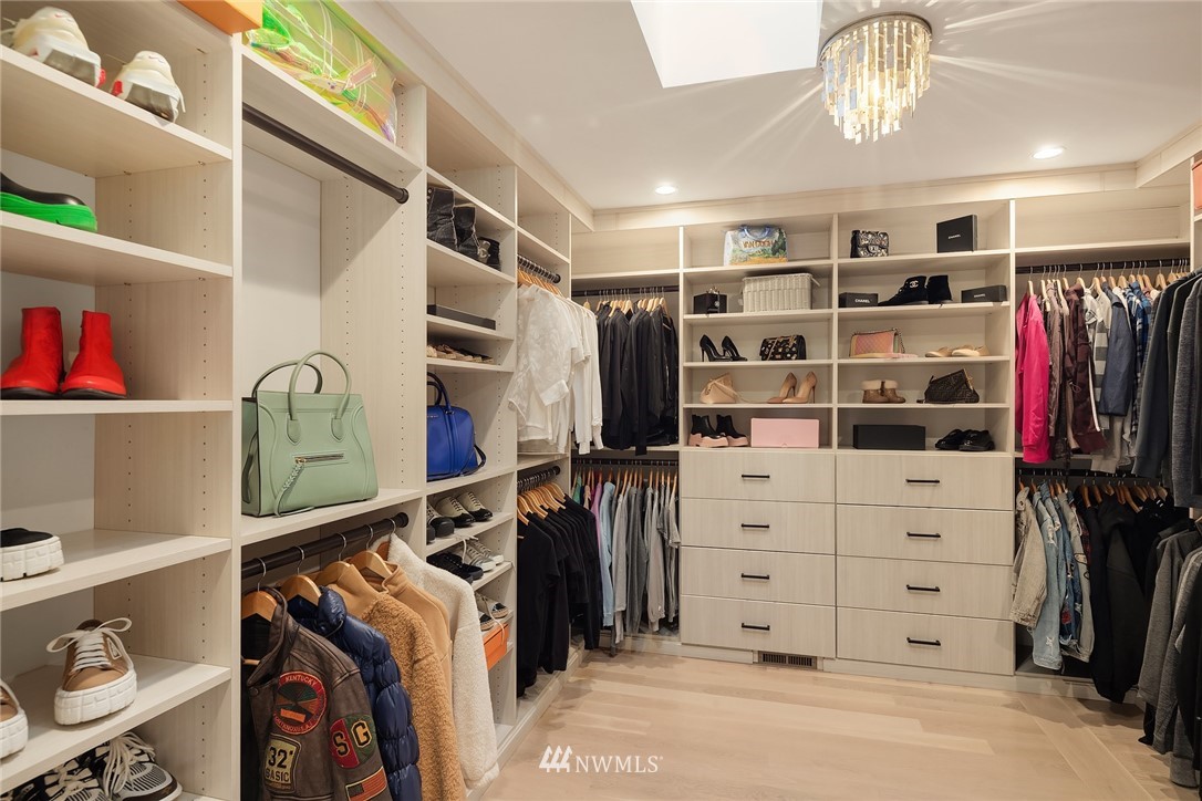 3223 Evergreen Point Road Medina, WA 98039 - Photo 17 of 36 a view of walk in closet with clothes and shoes